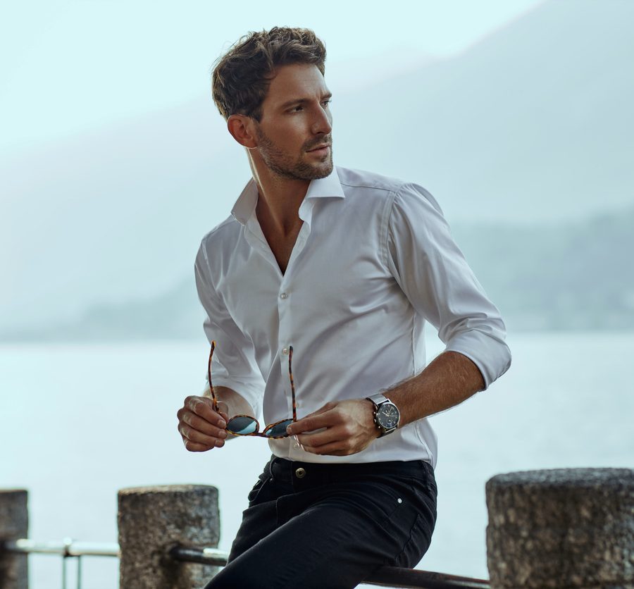 a man standing in front of a mountain