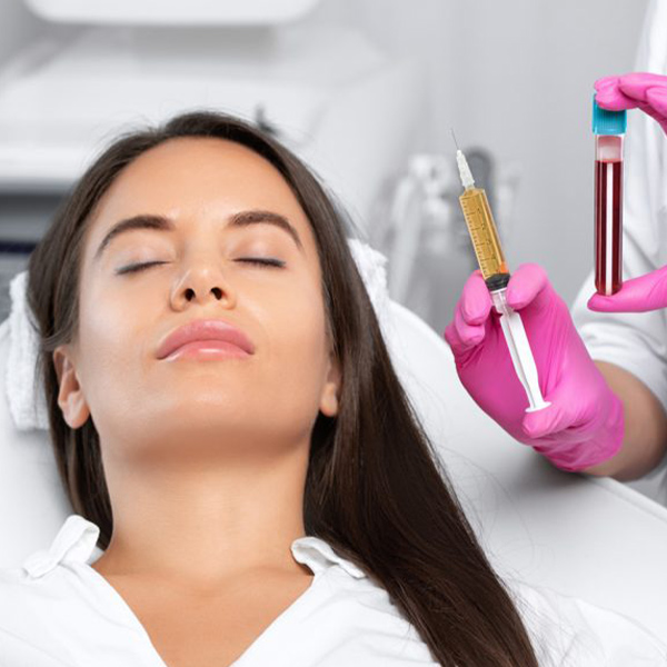 a woman holding a toothbrush