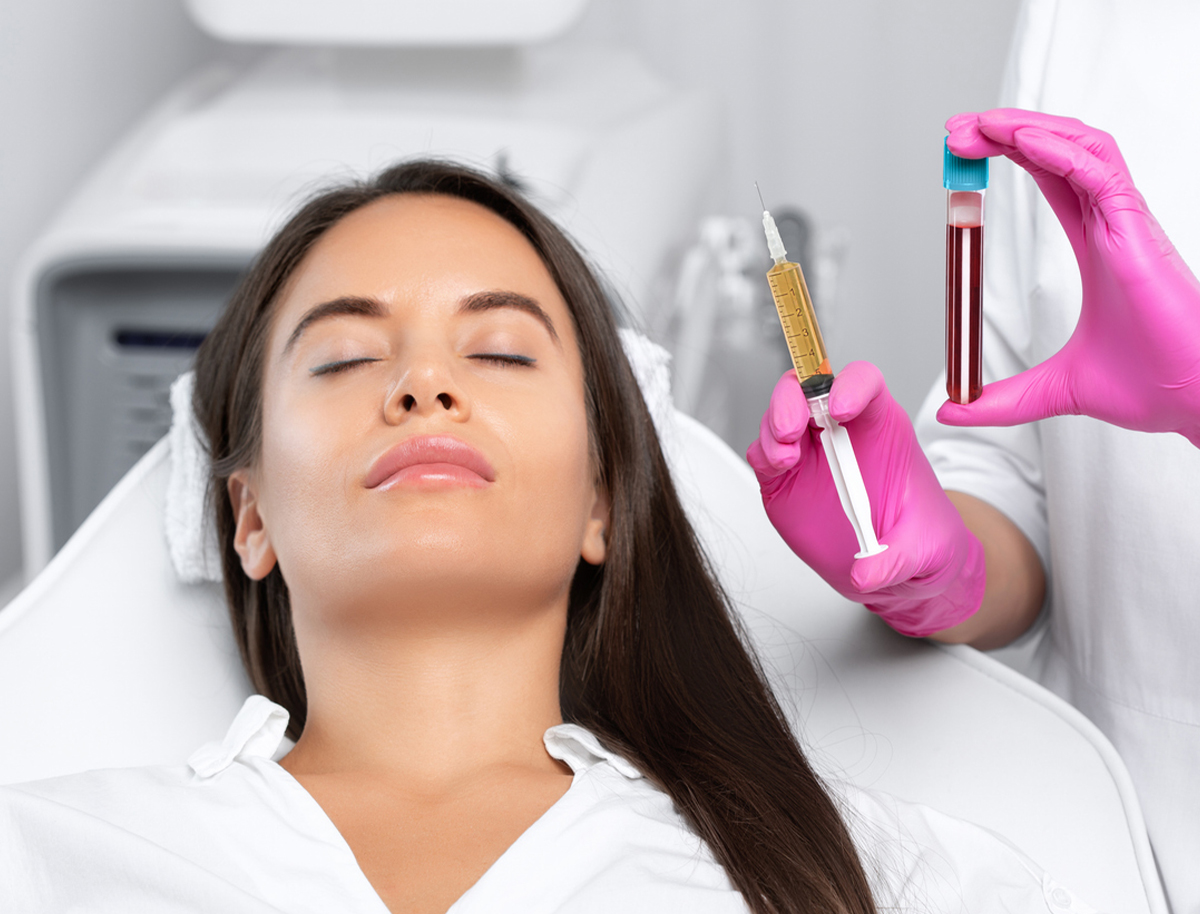 a woman holding a toothbrush